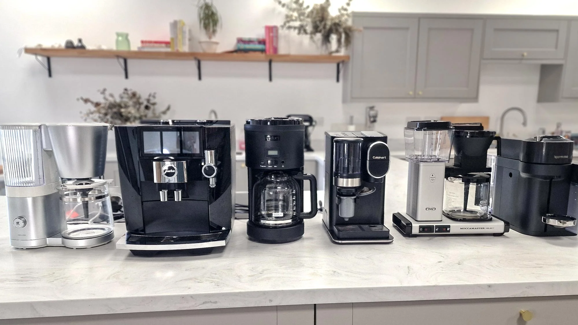 A sleek, modern smart coffee maker brewing coffee