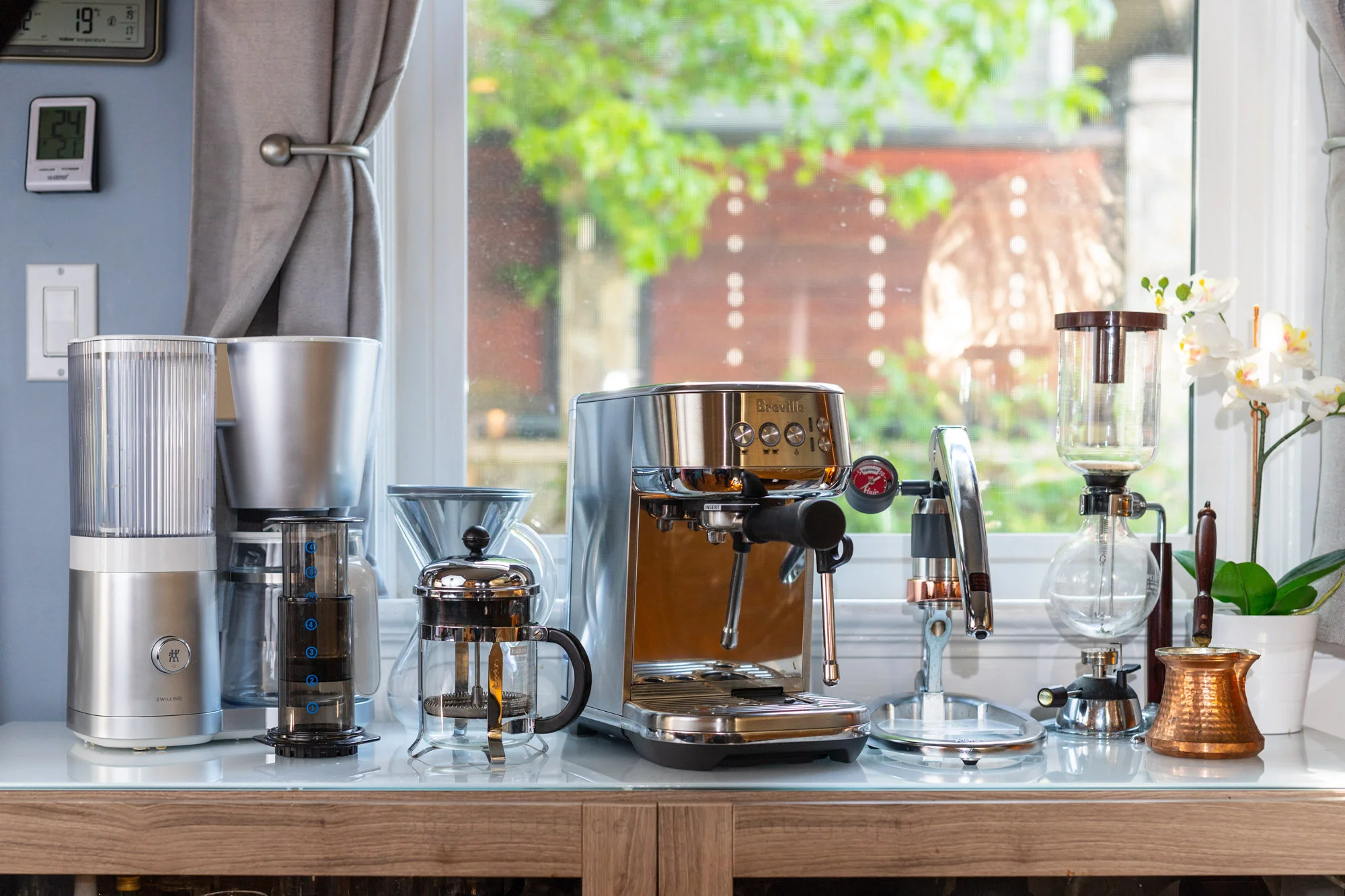 Freshly brewed coffee in a glass carafe on a drip coffee maker